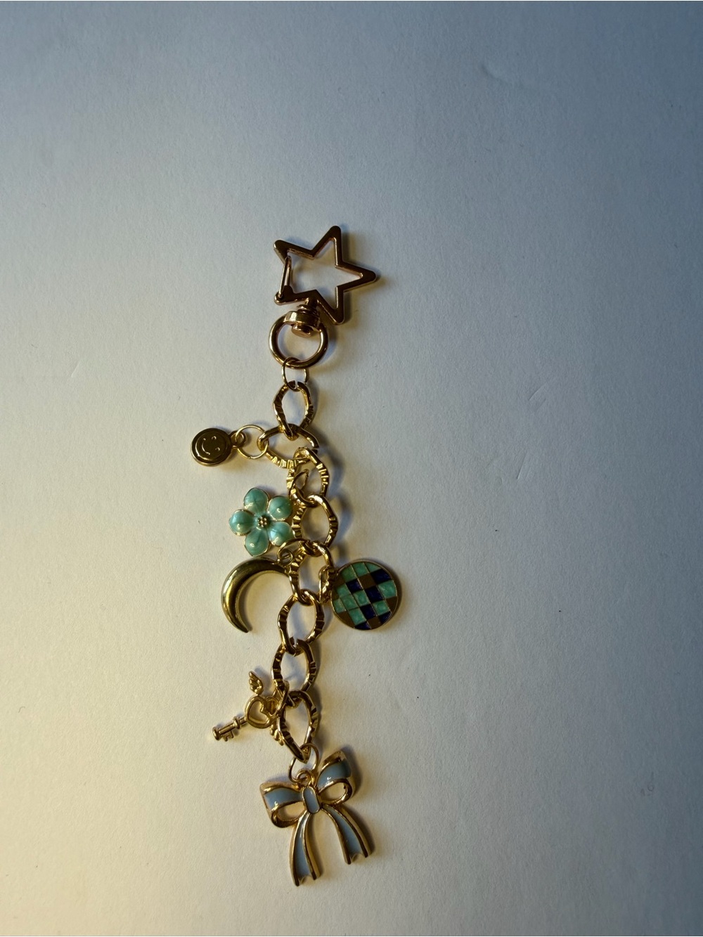 Gold-Tone Charm Bag Charm with Teal Flower & Bow